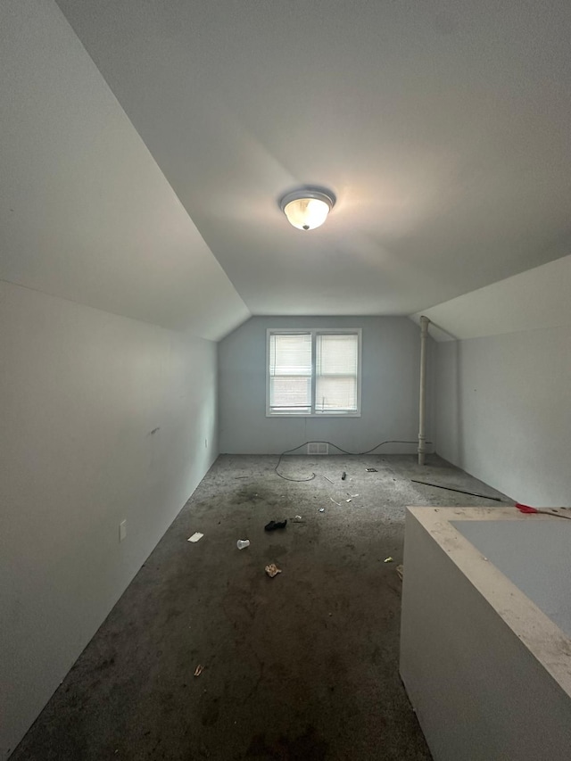 bonus room featuring vaulted ceiling