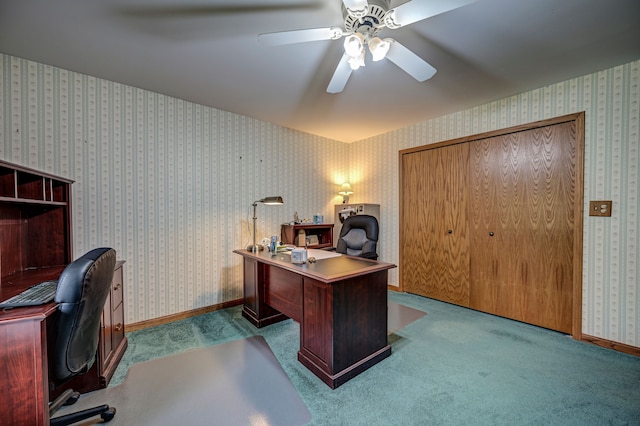 carpeted office featuring ceiling fan