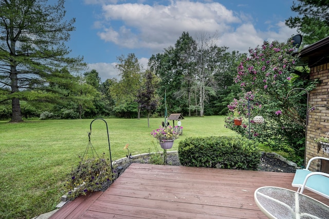 wooden deck with a yard