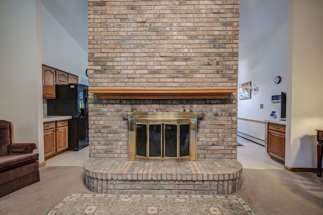 living room with light colored carpet, a fireplace, and high vaulted ceiling