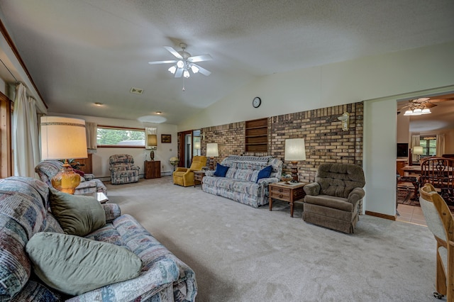 living room featuring a textured ceiling, light colored carpet, ceiling fan, and lofted ceiling