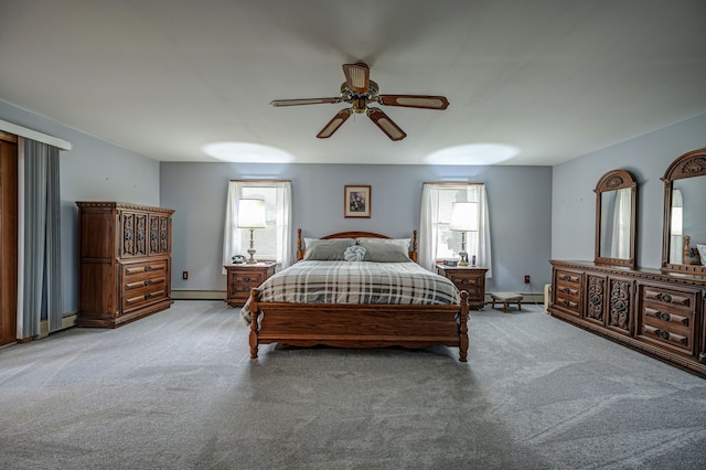 bedroom featuring light colored carpet, multiple windows, and ceiling fan