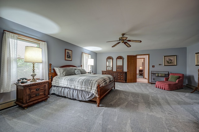 bedroom with ceiling fan, light carpet, and a baseboard radiator