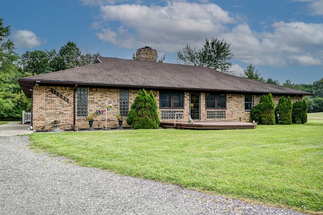 ranch-style home with a front lawn