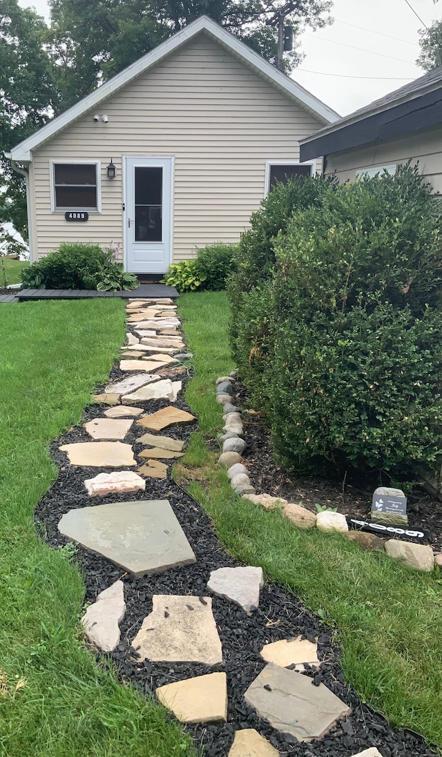 exterior space featuring a front lawn