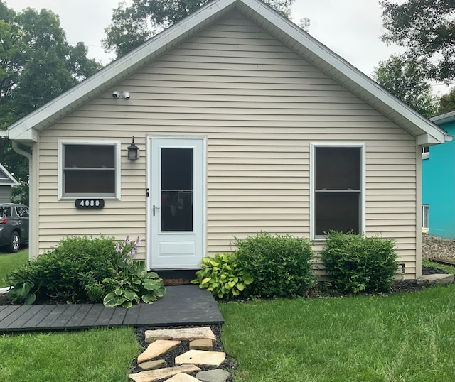 rear view of house with a lawn