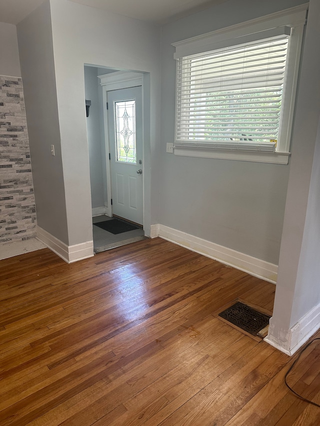 foyer entrance featuring hardwood / wood-style floors