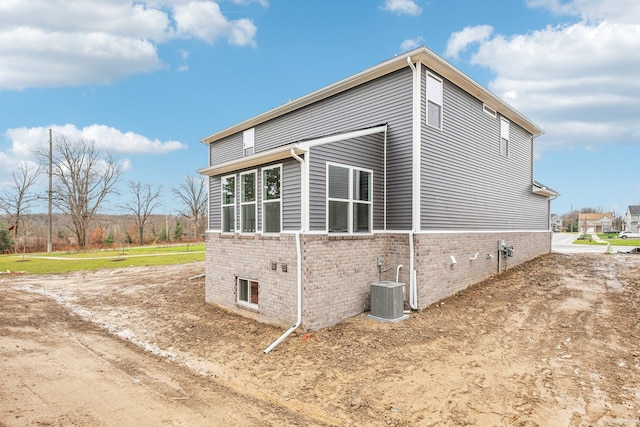 view of home's exterior with cooling unit