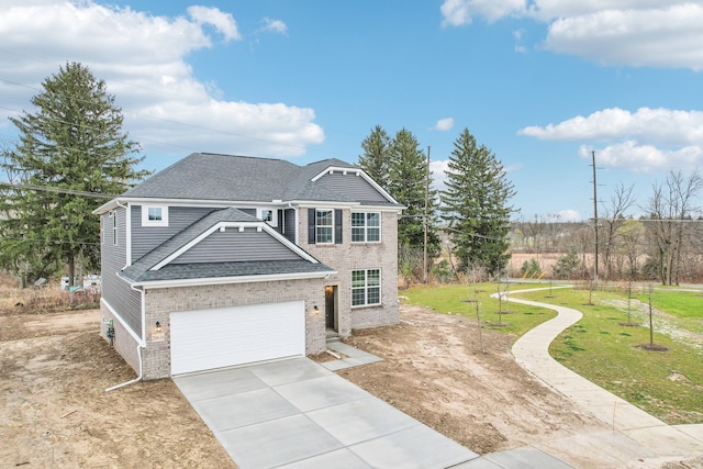 view of front of property featuring a front lawn and a garage