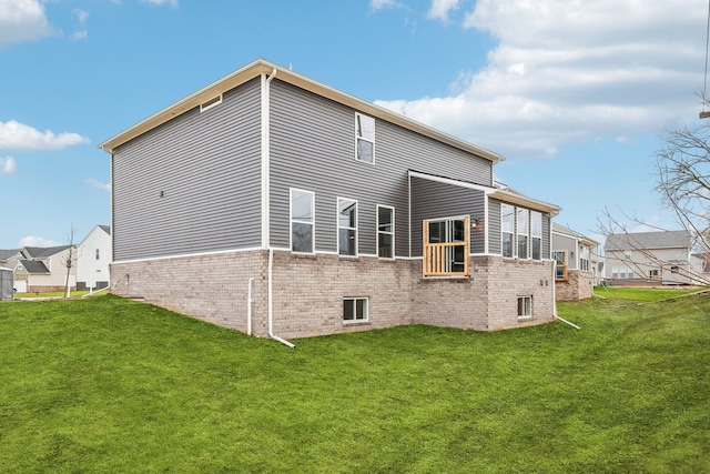 rear view of house with a yard