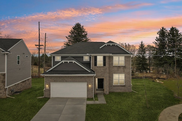 view of front of house featuring a garage and a lawn