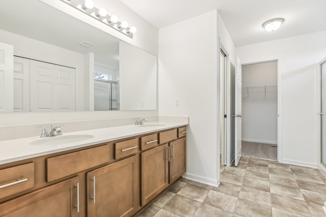 bathroom with walk in shower and vanity