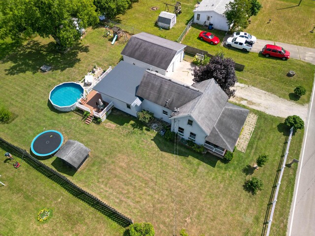 515 Locust St, Howard City, MI 49329 - aerial view of property and surrounding area featuring a pool area