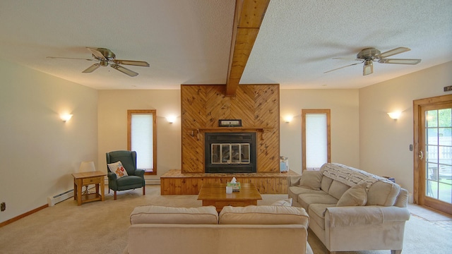 carpeted living room with ceiling fan, a textured ceiling, and a baseboard heating unit