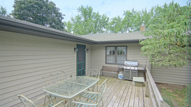 wooden deck with grilling area