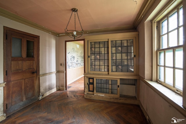 interior space featuring dark parquet floors and crown molding