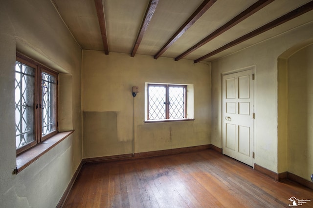 interior space with hardwood / wood-style floors, french doors, and beam ceiling