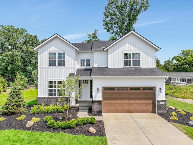 modern inspired farmhouse with a garage