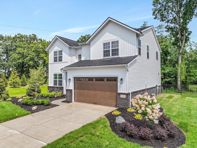 667 Allegheny Dr, South Lyon, MI 48178 - view of front of house featuring concrete driveway, roof with shingles, and an attached garage