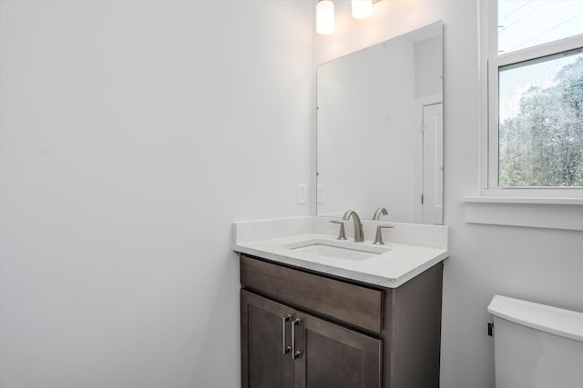 bathroom with vanity and toilet