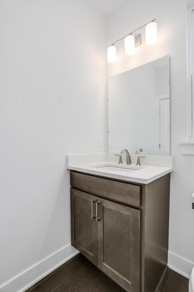 bathroom featuring vanity and hardwood / wood-style flooring