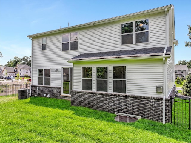 667 Allegheny Dr, South Lyon, MI 48178 - rear view of property featuring cooling unit and brick siding