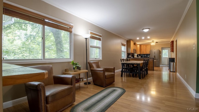 4241 Echo Cv, Manitou Beach, MI 49253 - living room featuring ornamental molding, light wood-style floors, and baseboards