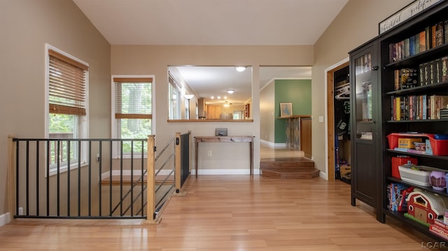 4241 Echo Cv, Manitou Beach, MI 49253 - hall with wood finished floors, baseboards, and an upstairs landing