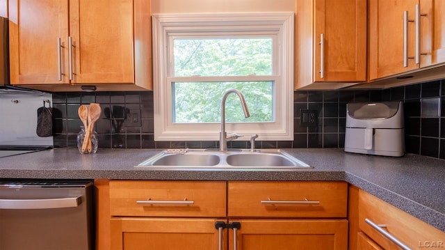 kitchen with dishwasher, backsplash, and sink