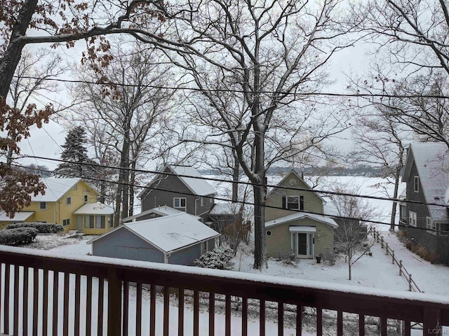 4241 Echo Cv, Manitou Beach, MI 49253 - snow covered deck featuring a residential view