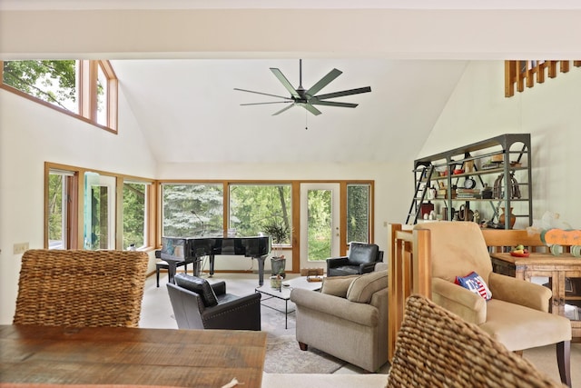 living room featuring ceiling fan and high vaulted ceiling