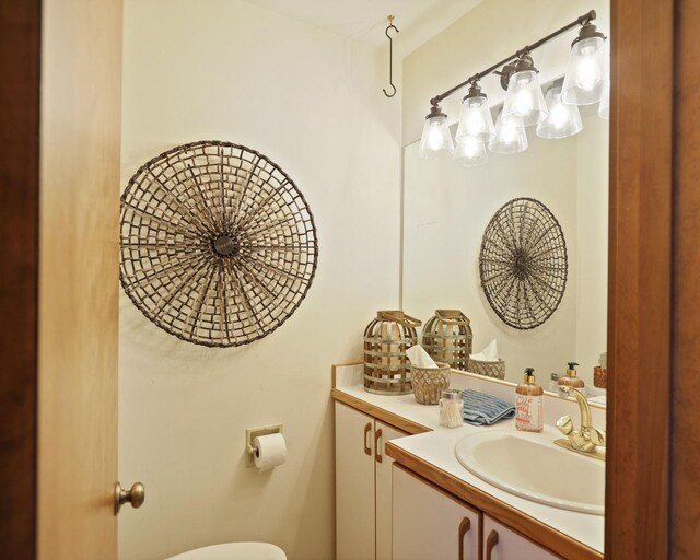 9300 Ormes Rd, Vassar, MI 49768 - half bathroom featuring vanity and toilet