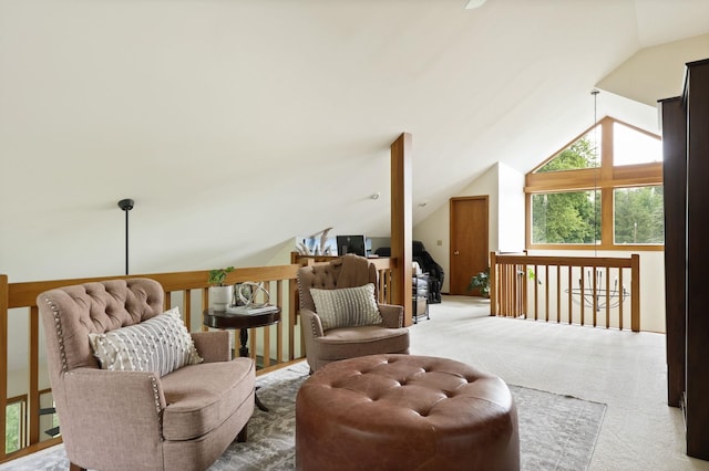 sitting room featuring carpet floors and lofted ceiling