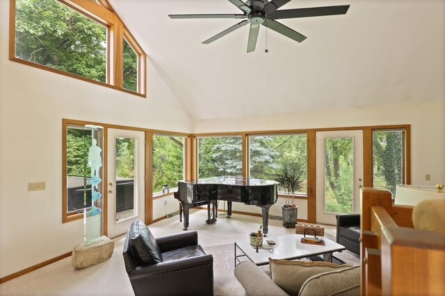 9300 Ormes Rd, Vassar, MI 49768 - living area with high vaulted ceiling, ceiling fan, and baseboards