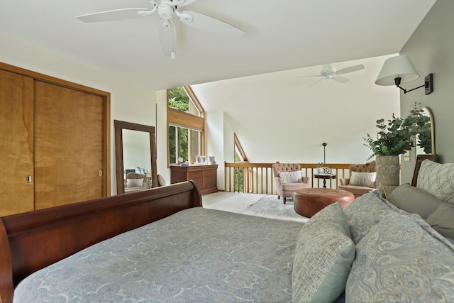 bedroom with vaulted ceiling, a closet, and ceiling fan