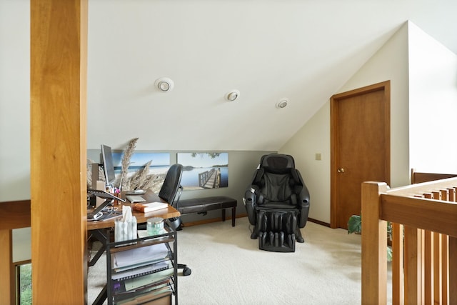 carpeted bedroom featuring a nursery area and lofted ceiling