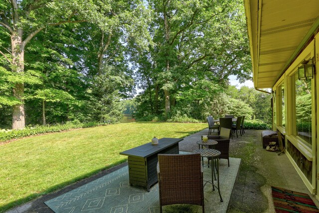 9300 Ormes Rd, Vassar, MI 49768 - view of patio featuring outdoor dining area and view of scattered trees
