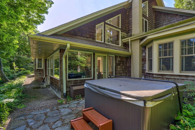 9300 Ormes Rd, Vassar, MI 49768 - rear view of property featuring a hot tub and a sunroom