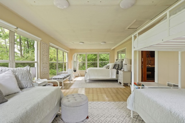 bedroom with multiple windows