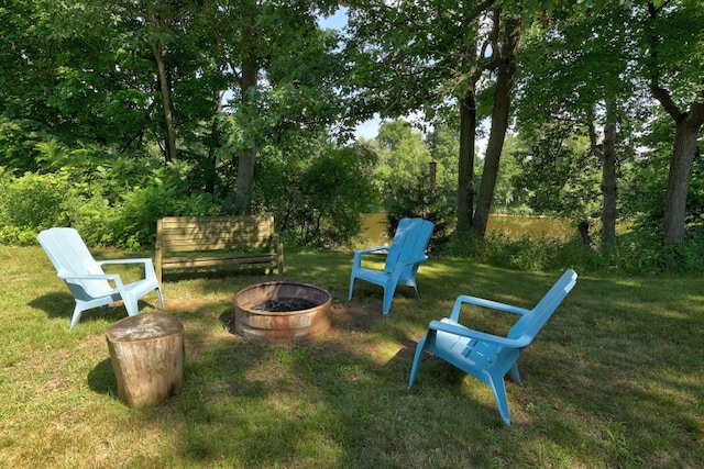 view of yard with a fire pit