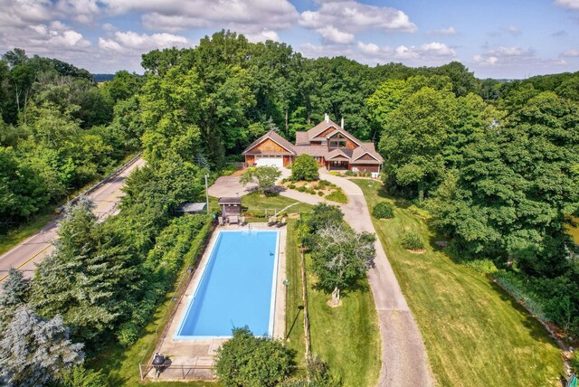 9300 Ormes Rd, Vassar, MI 49768 - view of property location featuring a pool area and a heavily wooded area
