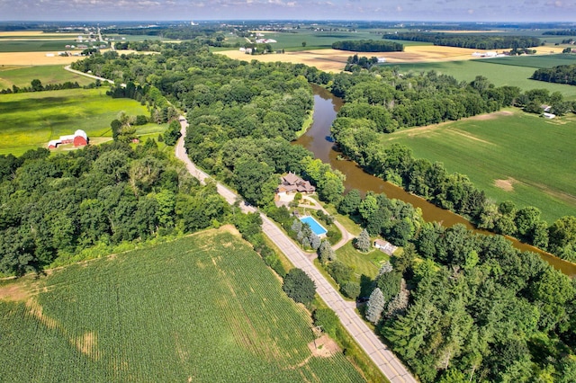 aerial view with a rural view and a water view