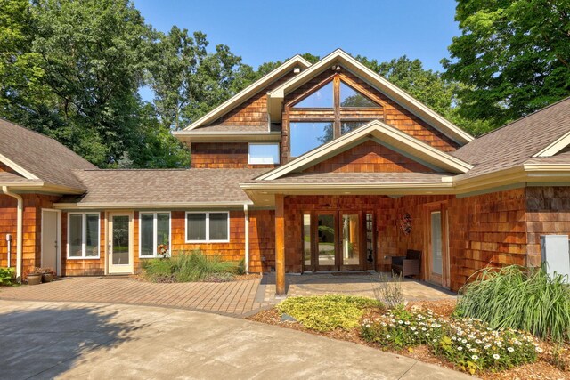 9300 Ormes Rd, Vassar, MI 49768 - view of exterior entry featuring roof with shingles and french doors