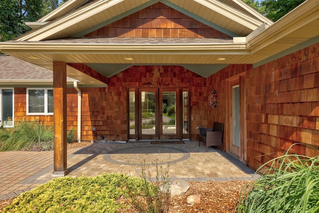 property entrance featuring french doors and a patio