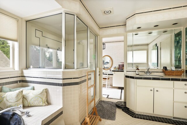 9300 Ormes Rd, Vassar, MI 49768 - bathroom featuring healthy amount of natural light, vanity, a shower with shower door, and tile patterned flooring