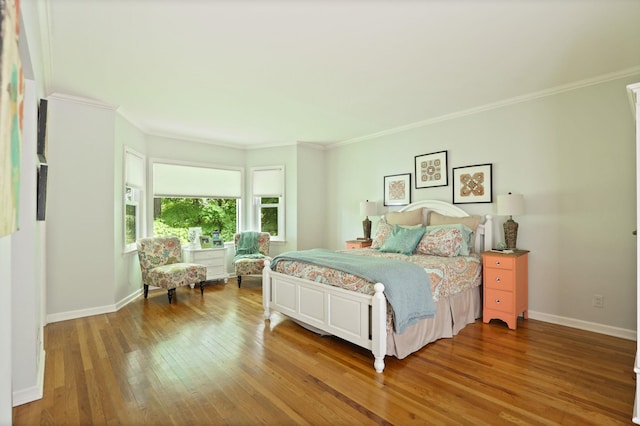 bedroom featuring ornamental molding and hardwood / wood-style flooring