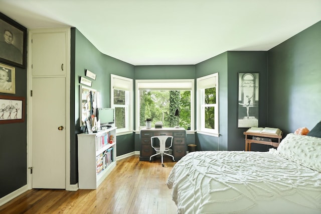 bedroom with light hardwood / wood-style flooring