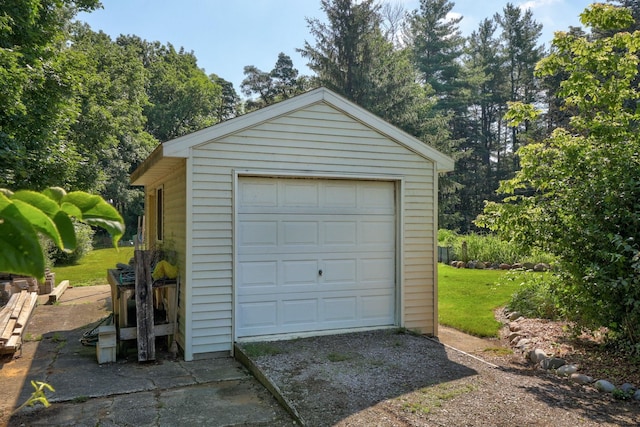 garage featuring a yard