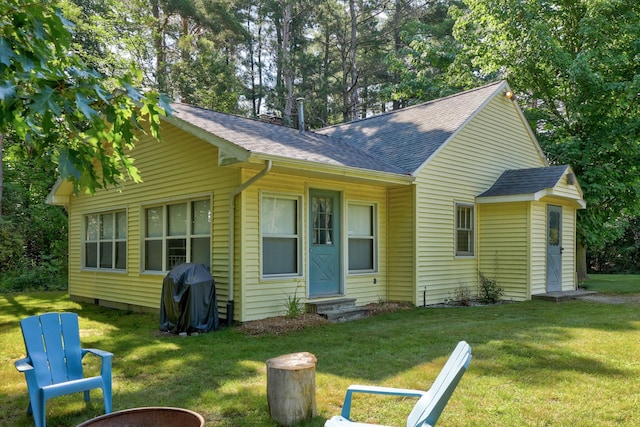 view of front of home with a front yard