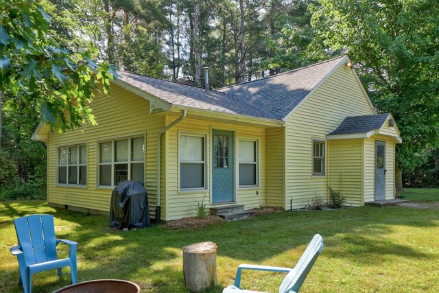 9300 Ormes Rd, Vassar, MI 49768 - view of front of property with entry steps, a shingled roof, and a front lawn